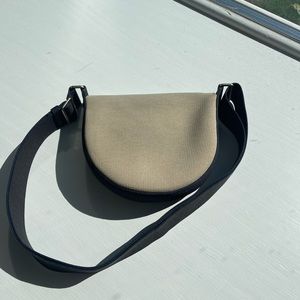 Rothy’s Ink and Ivory Saddle Bag